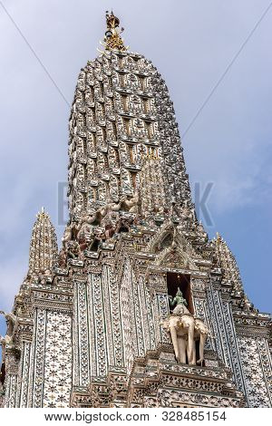 Bangkok City, Thailand - March 17, 2019: Side Of Main Spire Or Prang Of Temple Of Dawn Against Blue 
