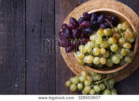 Healthy Fruits Red And White Wine Grapes On Stone Backgrounds