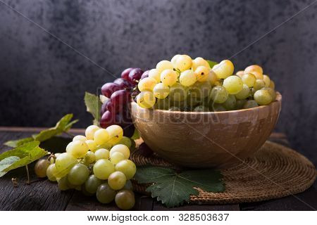 Healthy Fruits Red And White Wine Grapes On Stone Backgrounds. Fresh Grape
