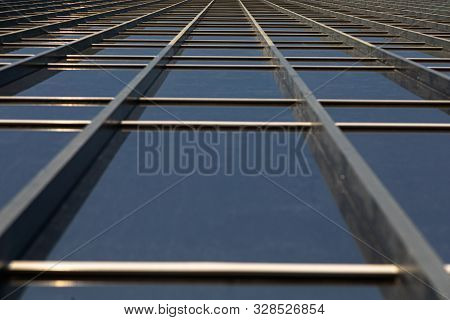 Bottom View Of Mirrorlike Office Building Wall