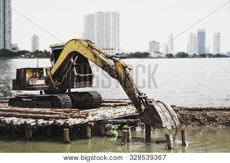 Excavator Or Digging Machine Working Bucket Digging Ground In Canal The Process Of Construction Site