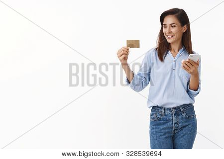 Finance, Money, Internet Concept. Carefree Relaxed Adult Woman Input Credit Card Number Order Clothe