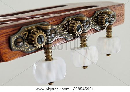Close Up Of Tuning Mechanism On Classical Guitar