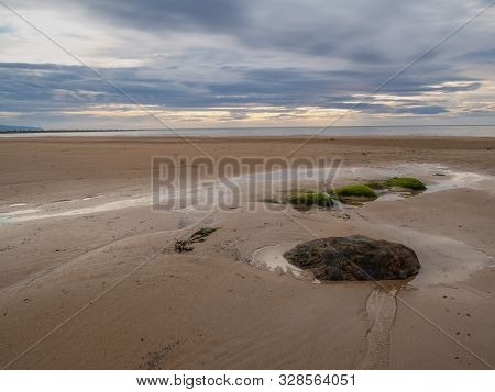 Stones On The Shore Of The North Sea In Brora