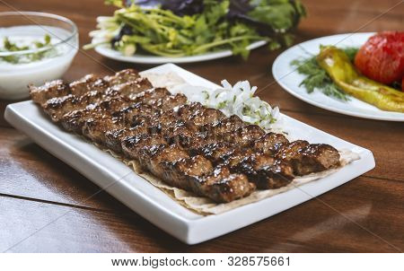 Fast Food. Eastern Food. Shish Kebab, Lyulya-kebab. Dishes Of Oriental Cuisine Lying In Plte And Dec