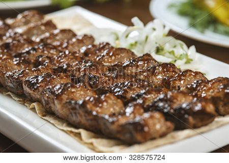 Fast Food. Eastern Food. Shish Kebab, Lyulya-kebab. Dishes Of Oriental Cuisine Lying In Plte And Dec