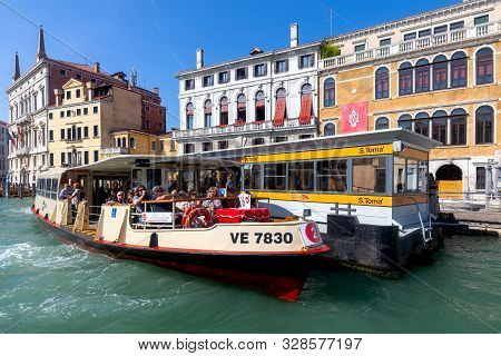 Venice, Italy - September 30, 2019: Vaparetto Passenger Boats On The Grand Canal On A Sunny Day.