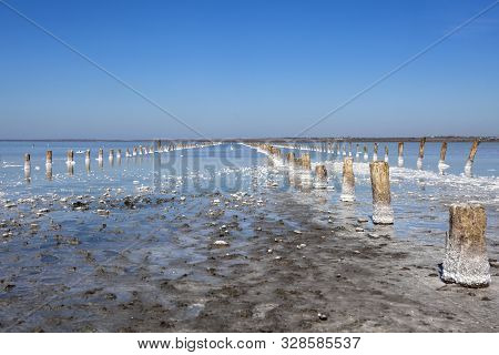 Salt Lake In The South Of Ukraine With Mud Baths. Treatment In A Salt Lake. Sanatorium. Blue Sky On 