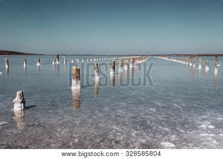 Salt Lake In The South Of Ukraine With Mud Baths. Treatment In A Salt Lake. Sanatorium. Blue Sky On 