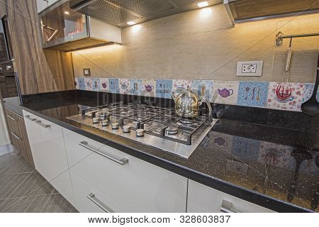 Interior Design Decor Showing Modern Kitchen Cooker Hob Appliance With Extractor Fan In Luxury Apart