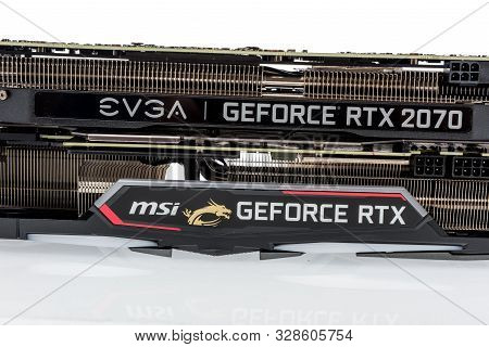 Winneconne, Wi - 10 October 2019:  A Pair Of Gpu Graphic Playing Cards From Msi And Evga On An Isola