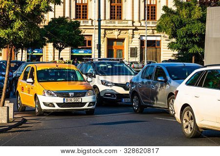 Car Traffic At Rush Hour In Downtown Area, Victoriei Boulevard (calea Victoriei) In Bucharest, Roman
