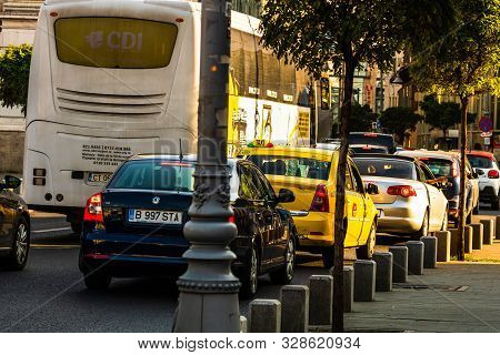 Car Traffic At Rush Hour In Downtown Area, Victoriei Boulevard (calea Victoriei) In Bucharest, Roman