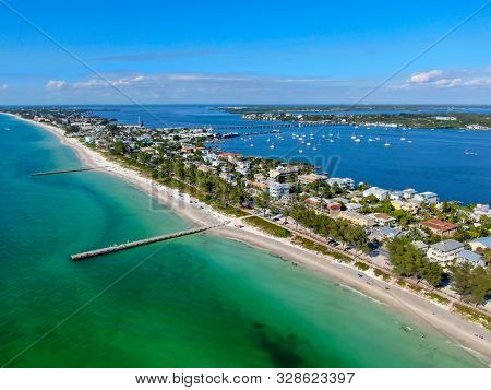 Aerial View Of Cortez Beach Withe Sand Beach And His Little Wood Pier On Blue Water, Anna Maria Isla