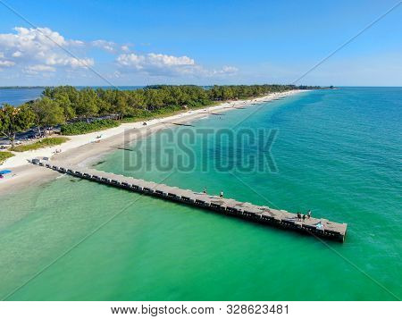 Aerial View Of Cortez Beach Withe Sand Beach And His Little Wood Pier On Blue Water, Anna Maria Isla