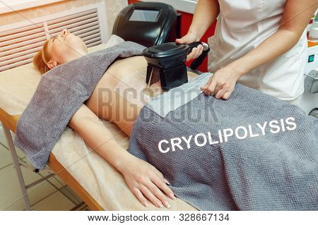Woman Getting Cryolipolysis Fat Treatment Procedure In Beauty Or Spa Salon