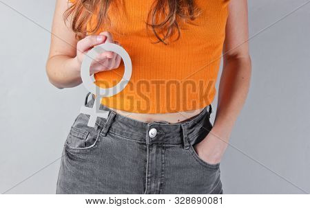 Femen Concept. Woman Holds In Her Hands Gender Feminism Symbol On Gray Background. Crop Photo, Studi