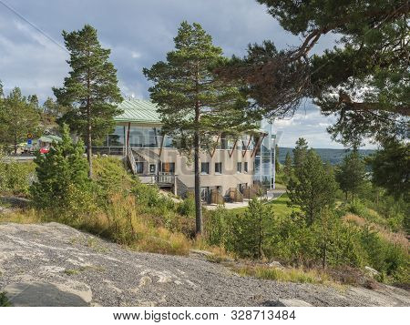 Utansjo, Sweden - August 21, 2019: View On Rounded Building Of Hotel Hoga Kusten Between Pine Trees 