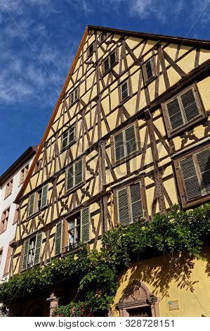 Riquewihr, France, October 13, 2019 : Old Half-timbered House. Popular Tourist Attraction For Its Hi