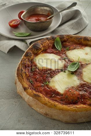 Pizza Margherita Served With Mozzarella Cheese, Tomato Sauce And Fresh Basil