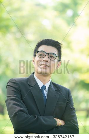Attractive Smart 30S Asian Business Men In City Public Park