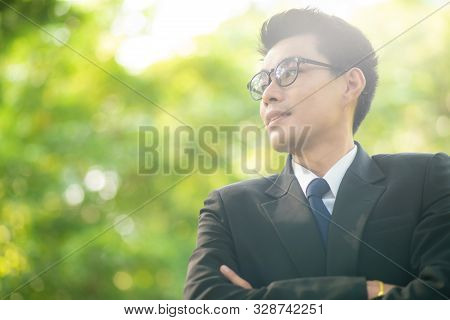 Attractive Smart 30S Asian Business Men In City Public Park