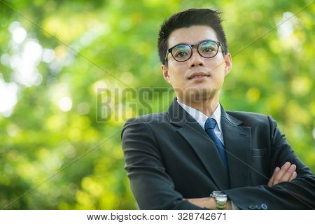 Attractive Smart 30S Asian Business Men In City Public Park