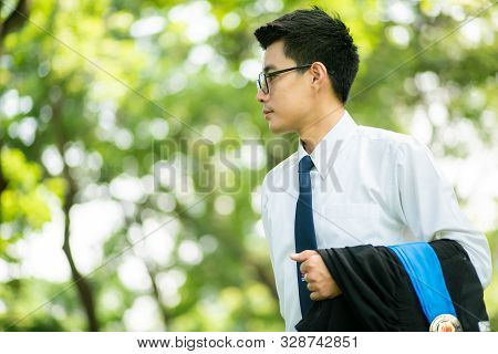Attractive Smart 30S Asian Business Men In City Public Park