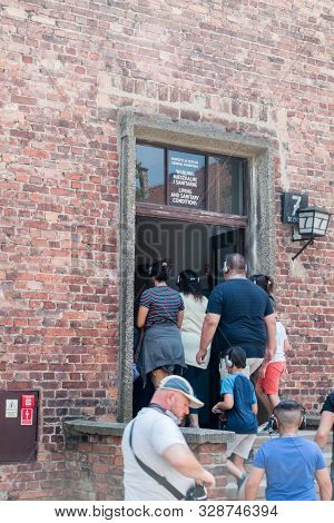 Oswiecim, Poland - July 28, 2019: People Entrance To Block 7 With General Exhibition About Living An
