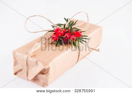 Gift Decorated With A Gunny String Bow And With A Common Yew Twig