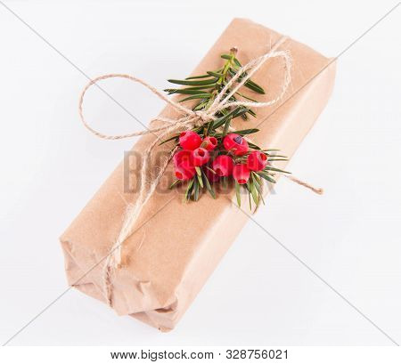 Gift Decorated With A Gunny String Bow And With A Common Yew Twig
