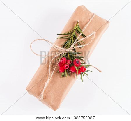 Gift Decorated With A Gunny String Bow And With A Common Yew Twig