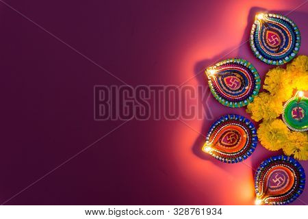 Indian Festival Diwali, Diya Oil Lamps Lit On Colorful Rangoli. Hindu Traditional. Happy Deepavali.