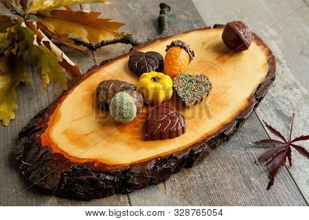 Autumn Chocolate Bonbon Decorated With Some Leaves