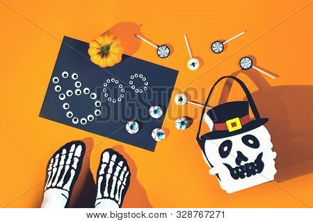 Happy Halloween Candy Bucket Face Of Jack O Lantern With Lollypops With Spiders And Nets On Orange B