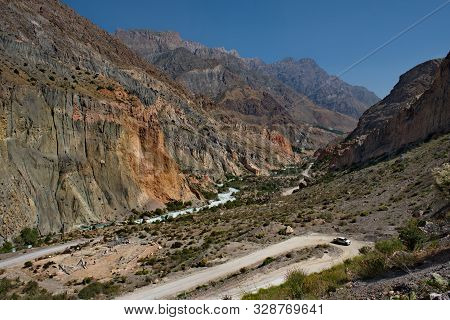 Tajikistan. The Pamir Highway. Panorama Of The Mountain River Iskanderdarya Flowing From Lake Iskand