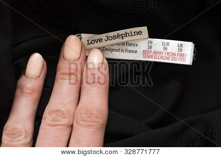 Kharkiv, Ukraine - September 19, 2019: Tag Love Josephine With Female Hand On Black Clothes. Close-u