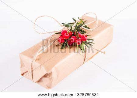 Gift Decorated With A Gunny String Bow And With A Common Yew Twig