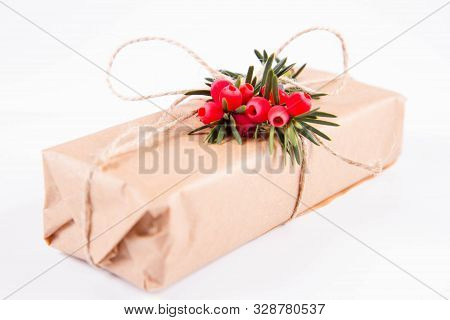 Gift Decorated With A Gunny String Bow And With A Common Yew Twig