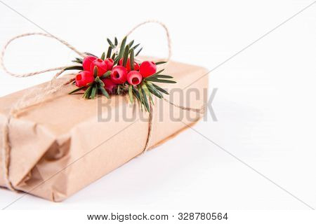Gift Decorated With A Gunny String Bow And With A Common Yew Twig