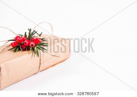 Gift Decorated With A Gunny String Bow And With A Common Yew Twig