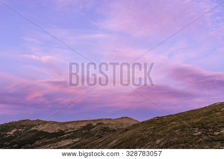 Unusually Beautiful Sky In The Mountains. Beautiful Purple Sky. Magenta Background.