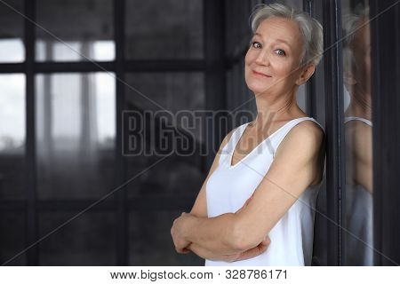 Portrait Of Happy Mature Woman Indoors, Space For Text. Smart Aging