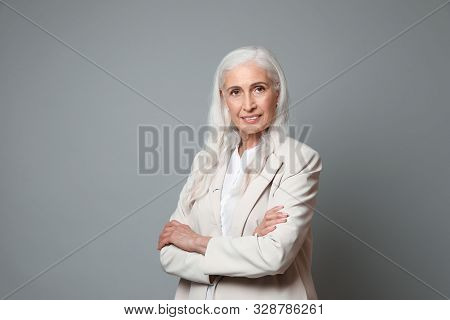 Portrait Of Beautiful Mature Woman On Grey Background, Space For Text