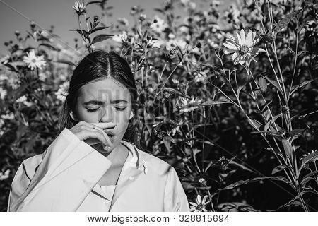 The Girl Suffers From Pollen Allergy During Flowering And Uses Napkins. Young Woman Got Nose Allergy