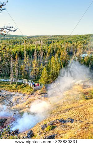 Sunset Over Artists Paintpot Trail As Steam Rises From The Geysers And Hot Springs At Yellowstone Na