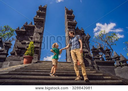 Dad And Son Tourists In Budhist Temple Brahma Vihara Arama Banjar Bali, Indonesia. Honeymoon