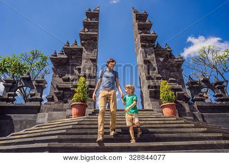 Dad And Son Tourists In Budhist Temple Brahma Vihara Arama Banjar Bali, Indonesia. Honeymoon