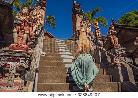 Young Woman Tourist In Budhist Temple Brahma Vihara Arama Bali