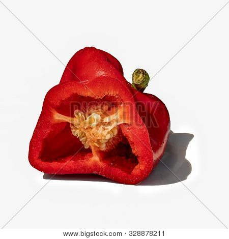 Red Pepper In Cross Section. Isolate On White Background